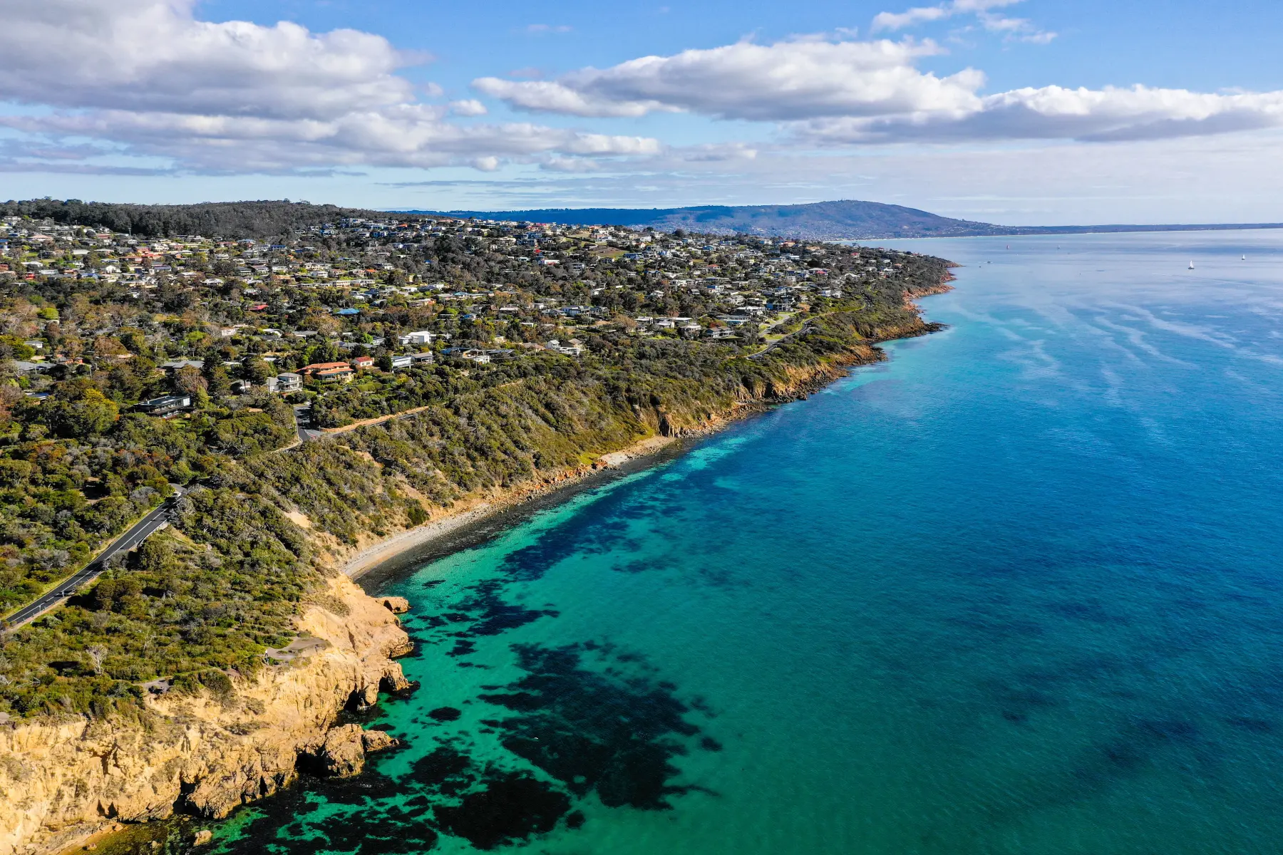 Aerial shot of Mount Martha coastline with turquoise water